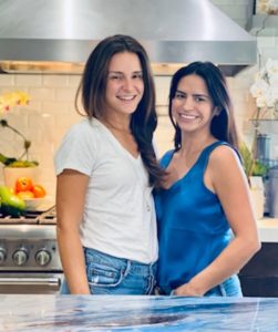 Cristina Bustamante and Ani Mezerhane in the kitchen.